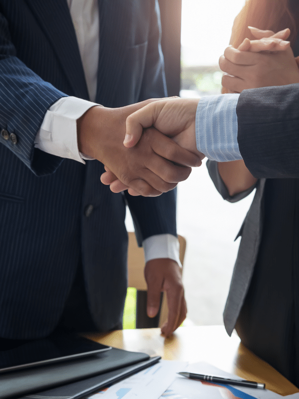 image showing two business person are doing handshake